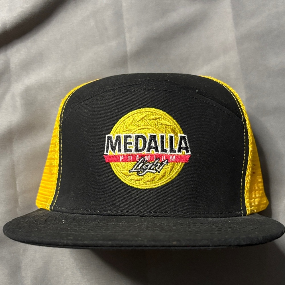 Medalla Premium Light Black and Yellow Trucker Hat